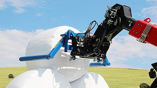 The BTGHY is the ideal tool stacking round bales.