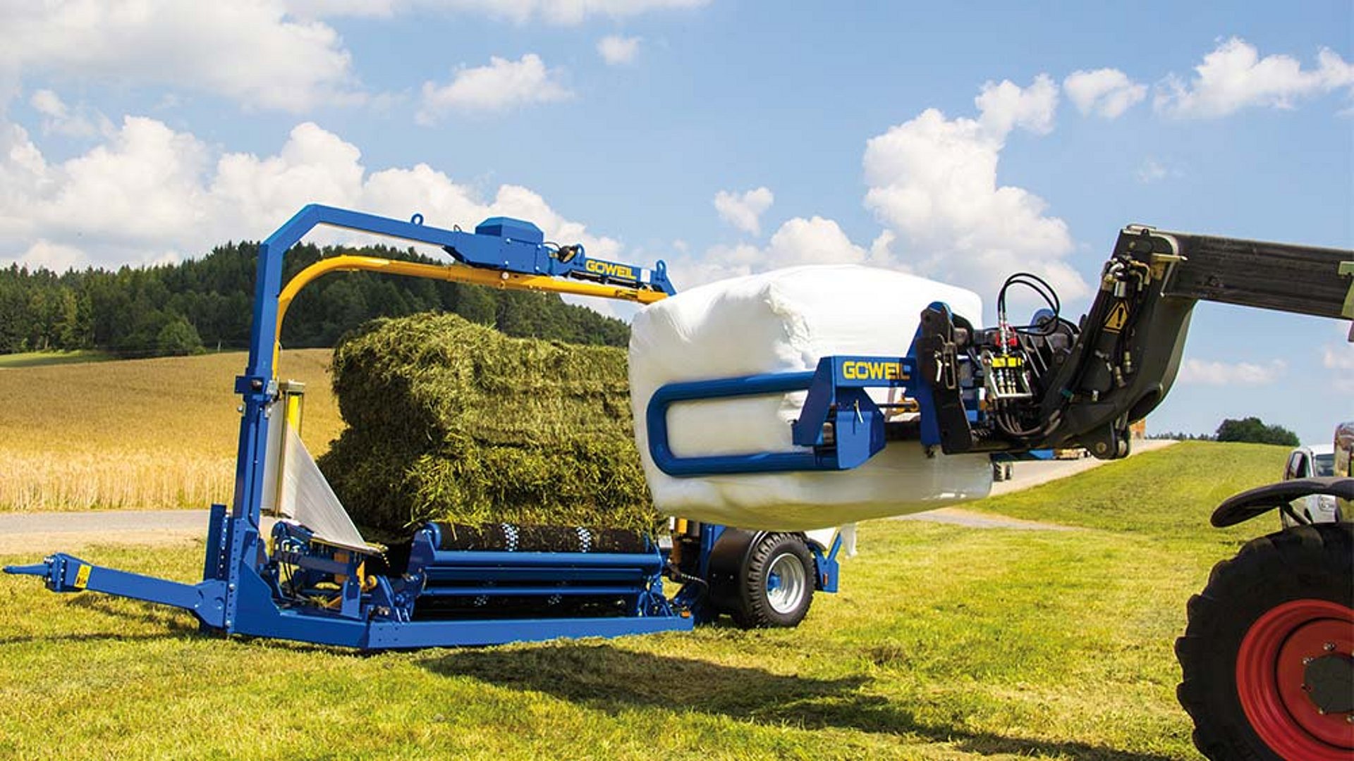 The fully wrapped square bale is hauled away with the BTGQU.