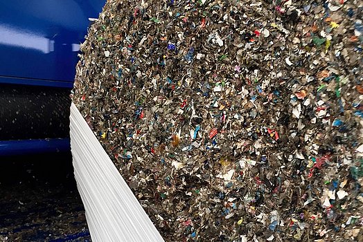 The bale is highly compacted inside the baler.