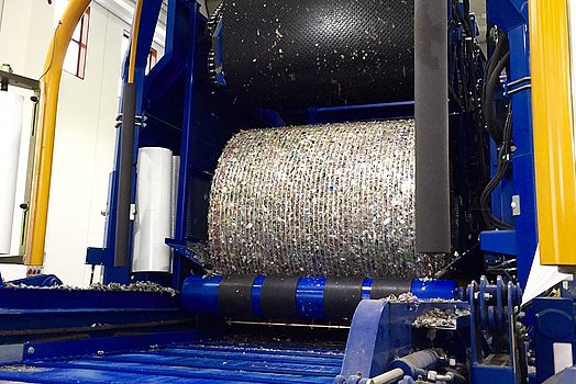 The bale is picked up by the mobile wrapping table.