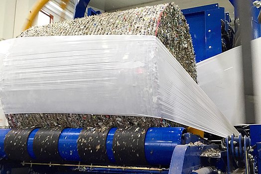 The bale is wrapped perfectly and then deposited.