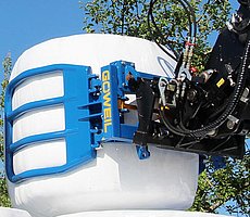 Speciální tvar ramen podavače brání při stohování poškození spodního balíku.