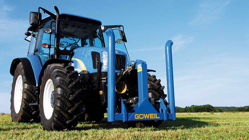 The transport arms of the round bale fork can be raised for road transport.