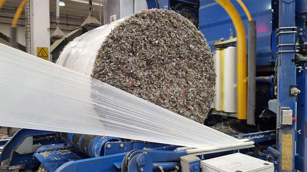 The pressed bales are air-tight packaged with a twin wrapping arm
